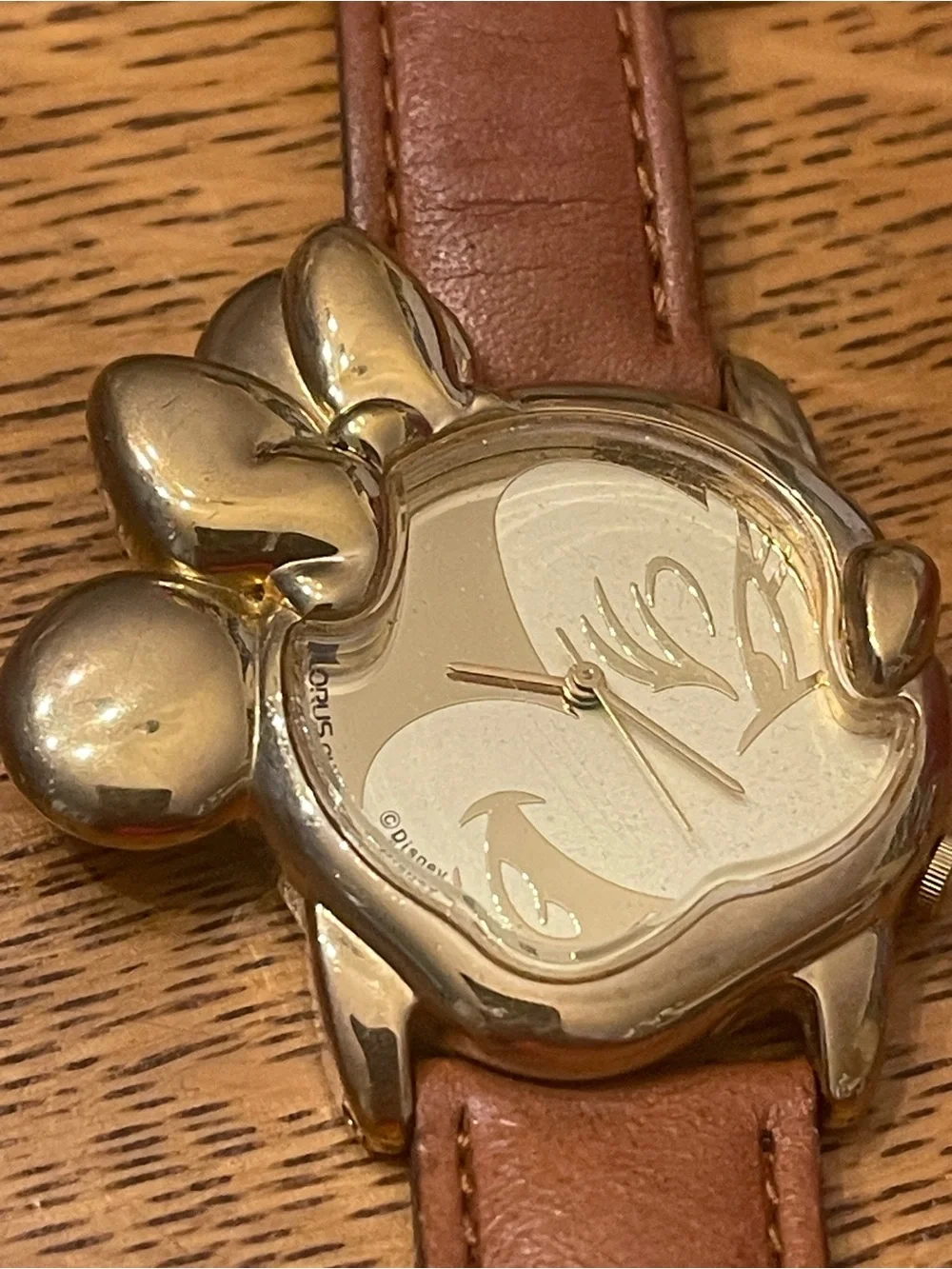 Vintage Lorus Minnie Mouse character watch featuring a distinct gold-tone Minnie